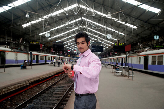 Businessman looking at the time 