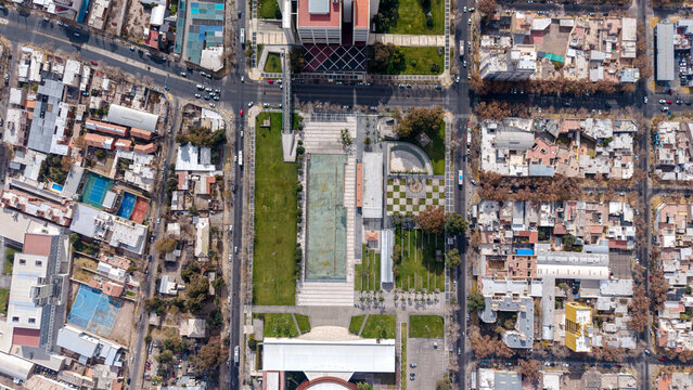 Aerial view of Bicentennial square with its central reflecting pool, landscaped gardens, and surrounding urban grid in San Juan, San Juan, Argentina.