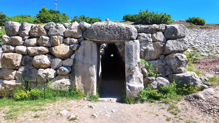 The exterior exit portal of the famous Yerkapı postern tunnel emerges beneath stone walls at ancient Hattusa, Turkey. © Tarik GOK