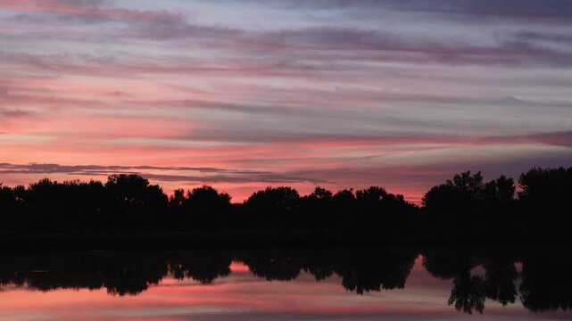 Pre Sunrise Reflections on Signature Bluffs Pond Colorado Closeup Sky Timelapse