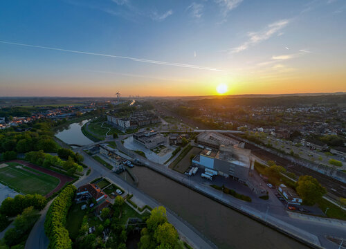 Halle, Vlaams Brabant, Belgium, 27th of April, 2025, An absolutely stunning aerial view beautifully showcasing a picturesque sunset over a winding and tranquil river