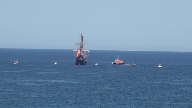 Historic Galleon with Spanish flag sailing close to the coast of Ireland in County Donegal