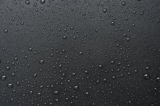 Oil drops on frying pan texture, water splash pattern on black non-stick coating