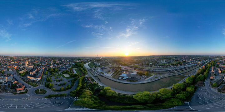Halle, Vlaams Brabant, Belgium, 27th of April, 2025, Experience a breathtaking sunrise illuminating the city, showcasing vibrant colors and unique urban scenery from above