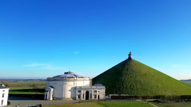 Napoleon Battlefield, Waterloo, Walloon Brabant, Belgium, March 4th, 2025, Admire the stunning aerial view of Lions Mound, a famous historic site in Belgium, under clear blue skies