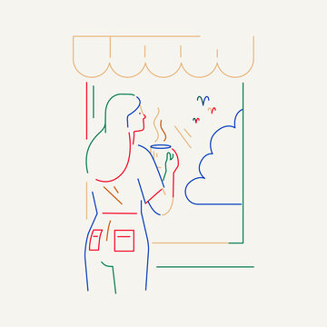 Woman drinking hot coffee by the window