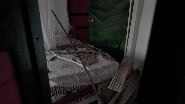 colombia earthquake bedroom debris and structural damage on bed