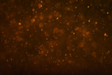 Golden oil droplets drift through a dark amber liquid in a soft macro. Concept food branding, cosmetic packaging, abstract backgrounds, banners and advertising. © kinomaster