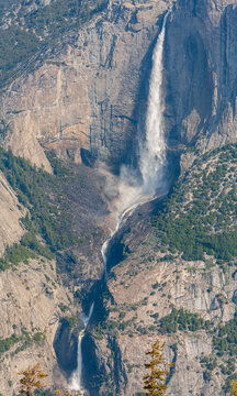 Vertical view of powerful Yosemite Falls with upper and lower cascades