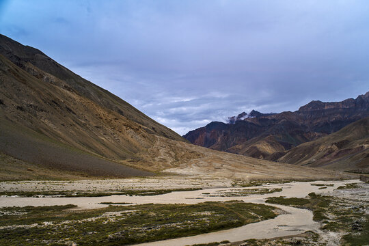 Glacial Torrent Stream Flowing Through V Shaped Mountain Valley Near Gonbo Rangjon in Zanskar, Ladakh, India. 