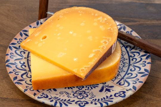 Aged Gouda, Dutch semi-hard cheese from Netherlands, golden-yellow colour, crystalline texture, cow milk matures cheese close up