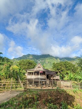 July 3, 2026 Bungaejae, Indonesia 
a traditional wooden stilt house standing in a beautiful rural or mountainous area.