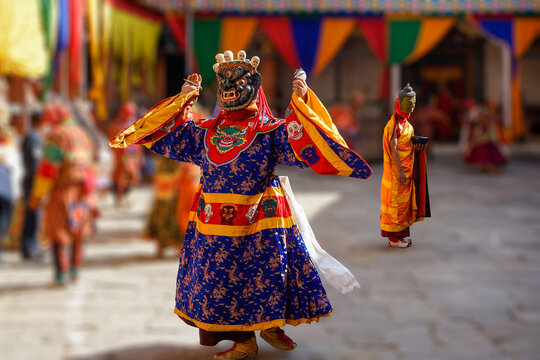 Bumthang in Bhutan, at the yearly festival in the monastery of Jakar. A monk is dancing in his colourful traditional dress and mask