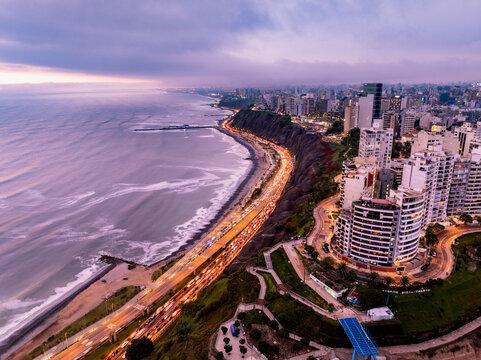 Aerial view of the coastal skyline and highway along the Pacific Ocean in Lima, Callao Region, Peru.