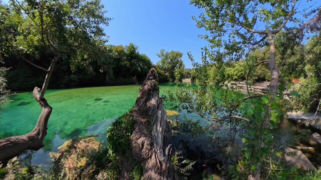 Footage of Nera river flowing through the crystal clear waters of Mole di Narni, Italy