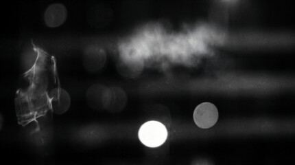 Abstract smoke on dark background, drifting vapor haze and bokeh light circles, moody atmospheric texture for design isolated on Transparent Background © GraphicsWorld