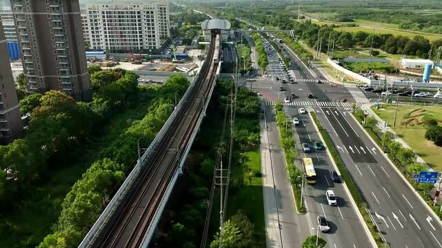 Forward Aerial View of Metro Train Entering Sheshan Station in Shanghai