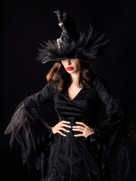 Beautiful witch in black Halloween hat