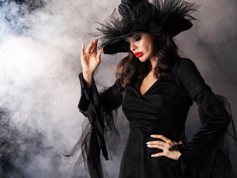 Beautiful witch in black Halloween hat