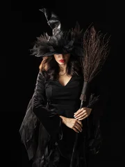 Beautiful witch in black Halloween hat © yellowj