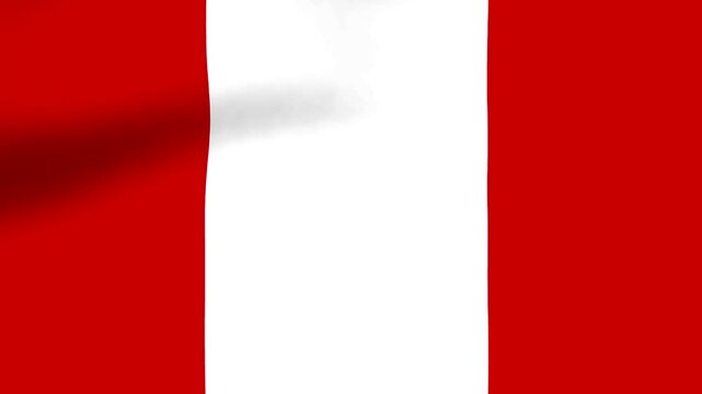 A close up view of the national flag of Peru waving gracefully in the wind with soft folds