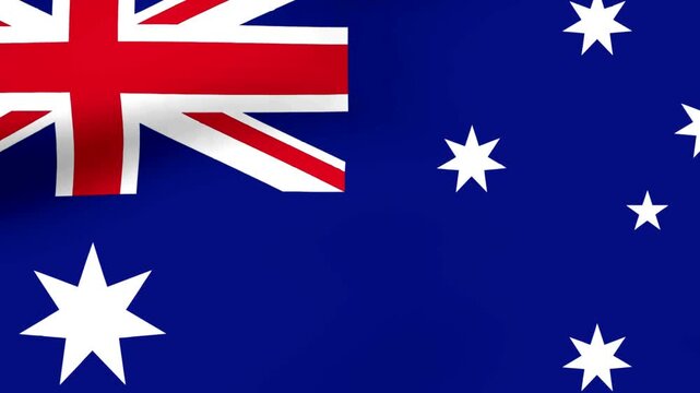 A close up view of the waving national flag of Australia featuring the Commonwealth Star and the Southern Cross