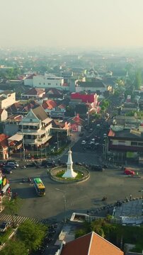 Wide aerial cityscape featuring Tugu Yogyakarta historic landmark