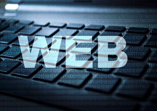 Web development concept with digital binary code overlay on a laptop keyboard.
