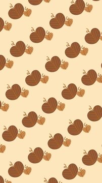 Seamless autumn pattern of heart shaped leaves on warm beige background animation for fall season wallpaper and Thanksgiving backdrop design.
