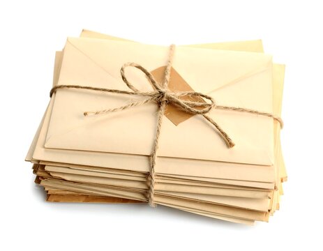 Stack of vintage letters tied with string in close up