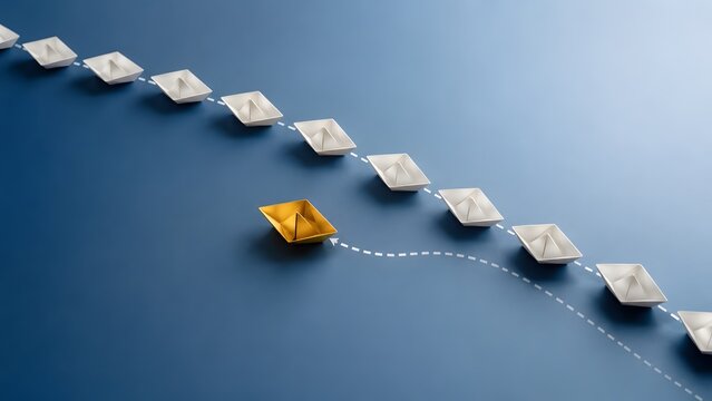 Golden paper boat breaking away from a line of white paper boats on a blue surface. Concept of business leadership, innovative thinking, and corporate competitive advantage.