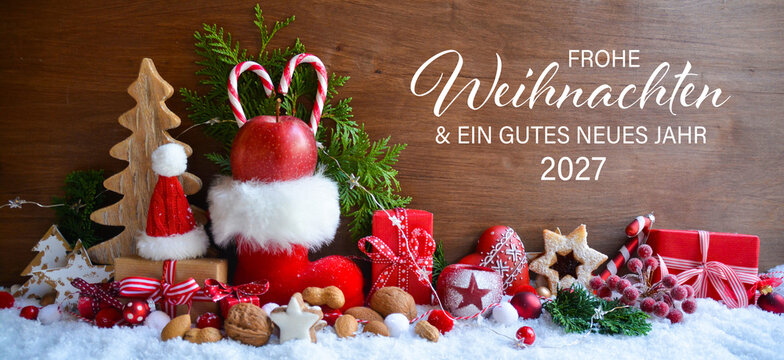Christmas greeting card with German text Frohe Weihnachten und ein gutes neues Jahr 2027 - Beautiful xmas decoration with Christmas boot in snow - Background banner - santa claus gift box