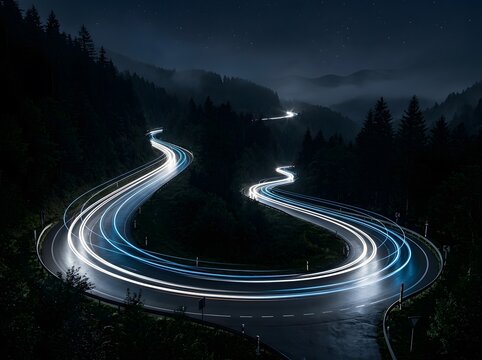 Winding mountain road at night with light trails and starry sky