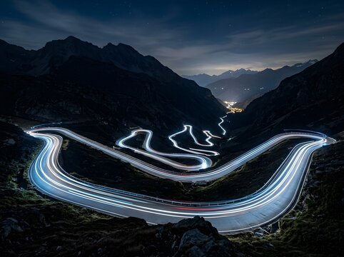 Mountain road with light trails at night under a starry sky landscape