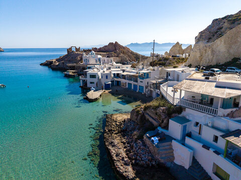 Picturesque waterfront of Firopotamos in Milos, Greece under clear blue skies