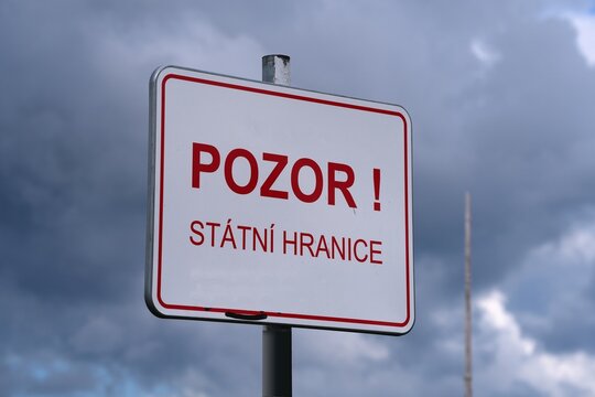 Pozor, statni hranice - Czech language sign meaning: Warning, state border. Sign on a mountain trail in Krkonose mountains.