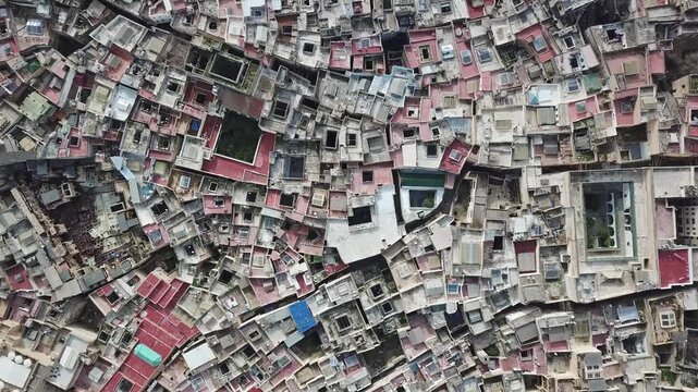 Aerial view of the historic medina in Fes, showing dense rooftops and narrow alleyways in Fes, Fez-Meknes, Morocco.