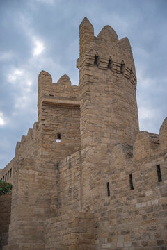 Medieval Baku Fortress wall and defense stone tower with cloud copy space