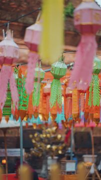 Colorful hanging lanterns decoration at Thai Wat Lok Moli in Asia, Traditional festive decor at Buddhist temple with cultural design and pattern, Chiang Mai, Thailand 4k vertical video