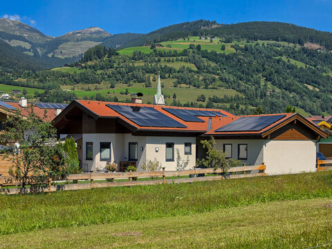 Austrian alpine village with solar panels on the roof