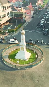 Close aerial view of iconic white Tugu Yogyakarta monument