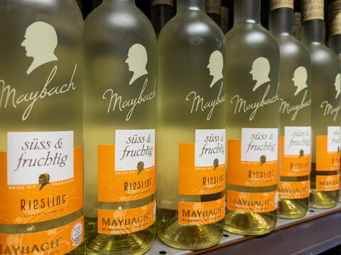 Kyiv, Ukraine - March 14, 2026: Maybach Riesling wine bottles arranged on a grocery store shelf, showcasing premium white alcohol for retail sale in a clean beverage market setting