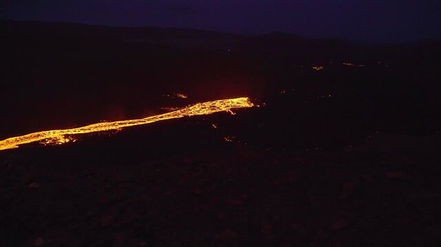 Eruption, magma flowing down a valley