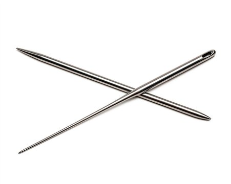 Crossed Metal Needles: A Close-Up View of Two Intersecting Metallic Tools