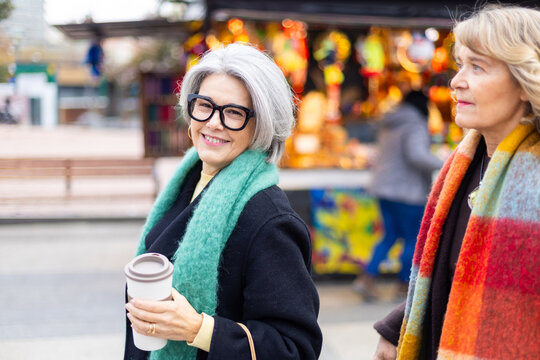 Senior women enjoying friendship in urban market