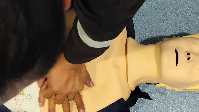 CPR Training ,Emergency and first aid class on cpr doll, Cardiopulmonary resuscitation, One part of the process resuscitation on unconscious person.