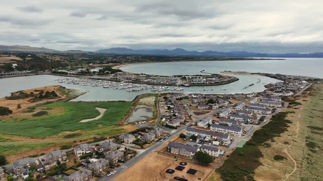 Aerial video of Pwllheli. Pwllheli  is a market town and community on the Llŷn Peninsula  in Gwynedd, north-west Wales. It had a population  Pwllheli is the place where Plaid Cymru was founded. 