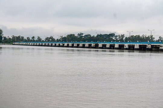Panoramic View of River Barrage Bridge Under Overcast Sky