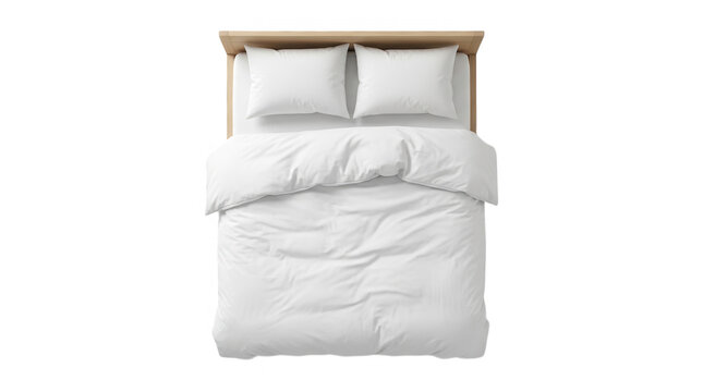 Top view of a comfortable double bed with a wooden frame and soft white bedding linens for a modern bedroom interior isolated on transparent background