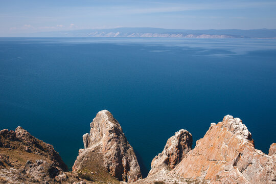 Rocky cliffs on shore of Olkhon Island at Lake Baikal, Siberia, Russia